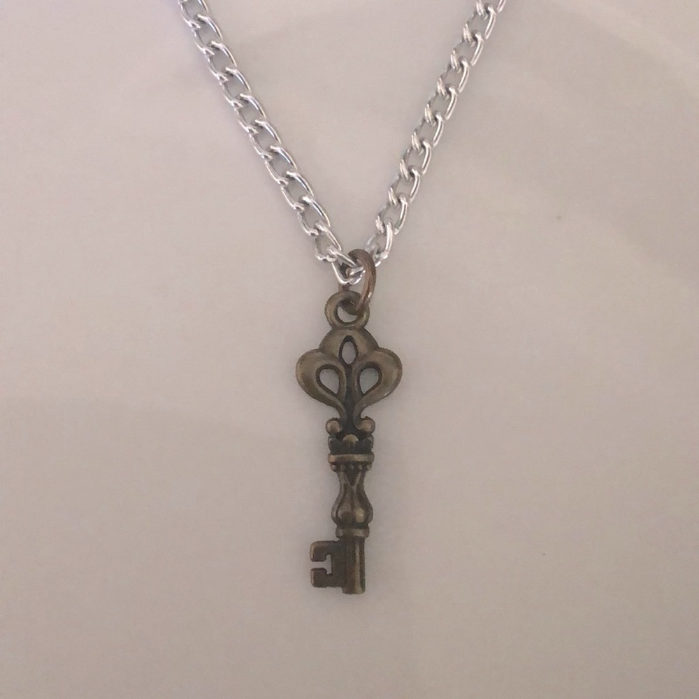 Bronze key on silver plated chain